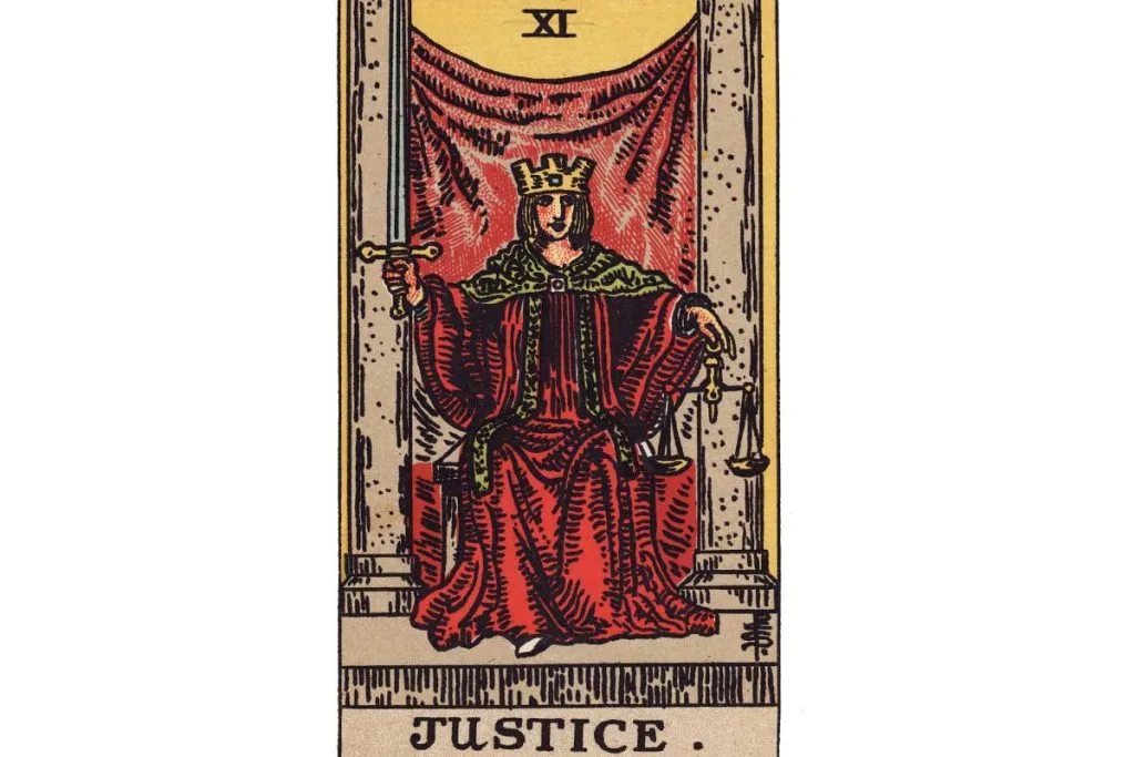 Meaning of The Justice Tarot Card: Logic, Intuition, & Fairness